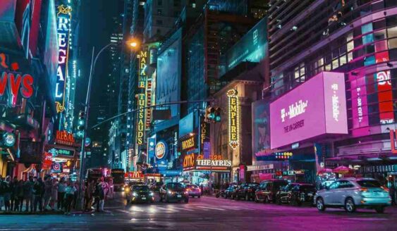 A busy urban city with multiple neon lit signs