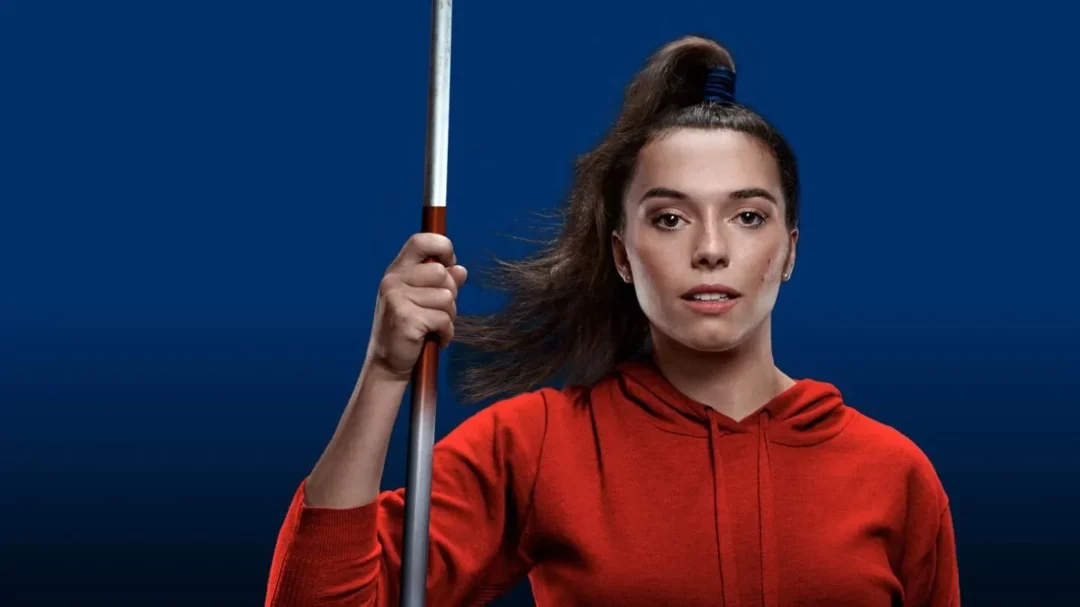 Pymble ladies’ college – empowering young women in sports through olympic pathway school - reborn - digital creative agency in sydney Young female athlete in red hoodie holding javelin, representing Pymble Ladies’ College Olympic Pathway School